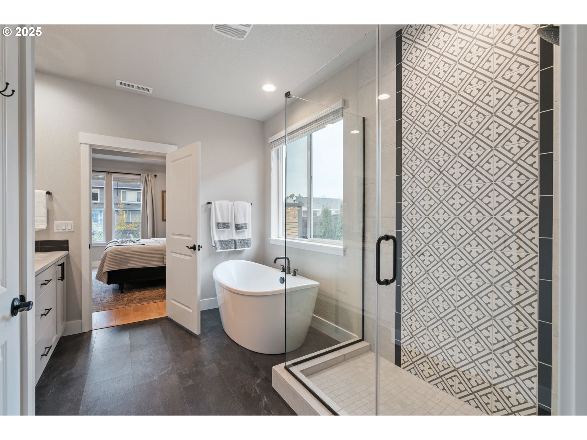 8842 North 3rd Circle Ridgefield, WA 98642 - Photo 29 of 46 a en suite bathroom with a sink and a mirror