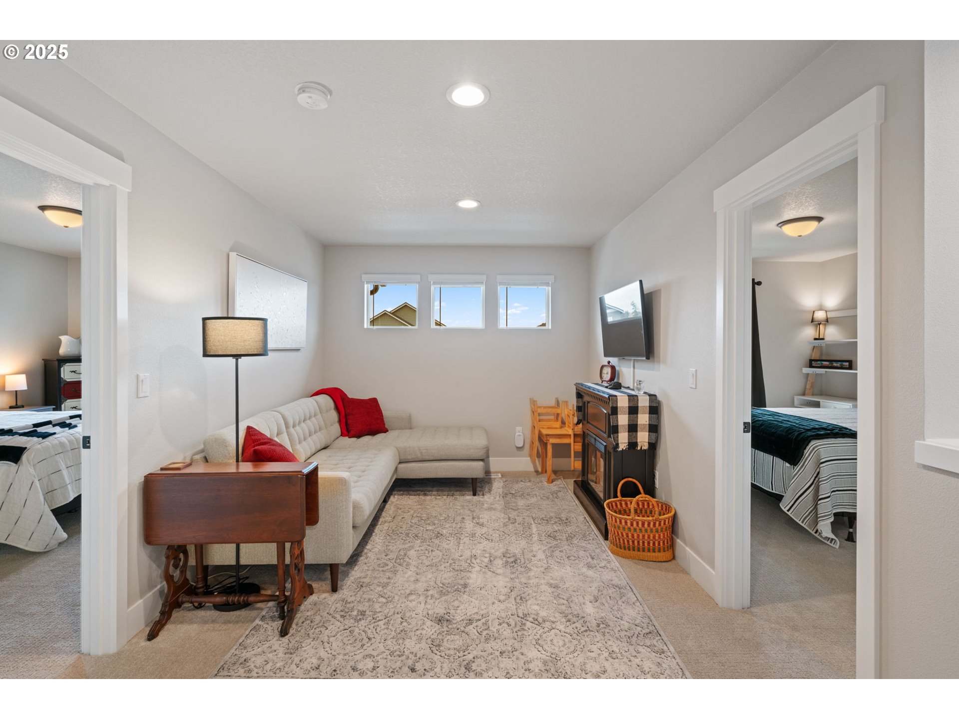 8842 North 3rd Circle Ridgefield, WA 98642 - Photo 32 of 46 a living room with furniture and a flat screen tv