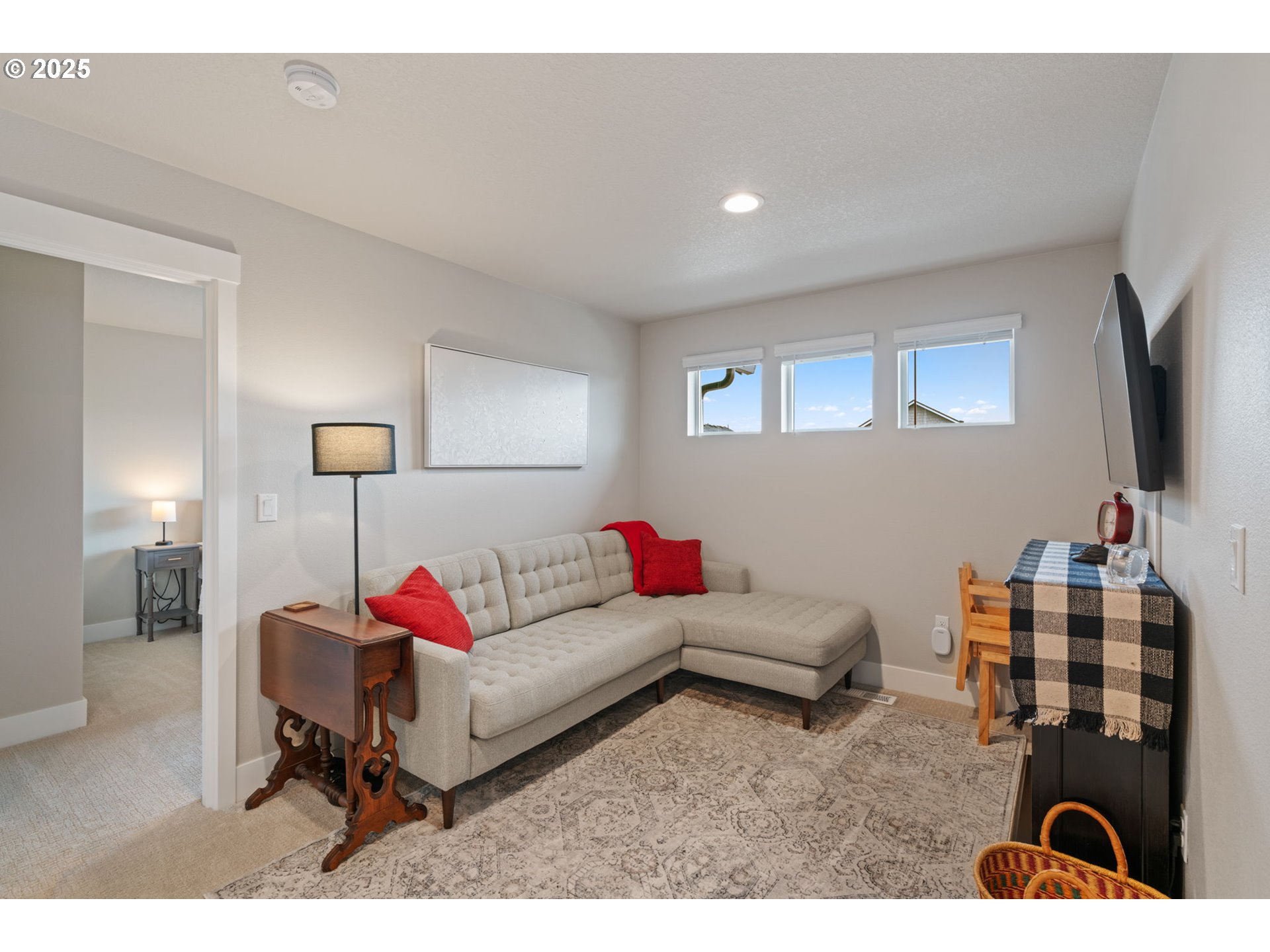 8842 North 3rd Circle Ridgefield, WA 98642 - Photo 33 of 46 a living room with furniture and a flat screen tv