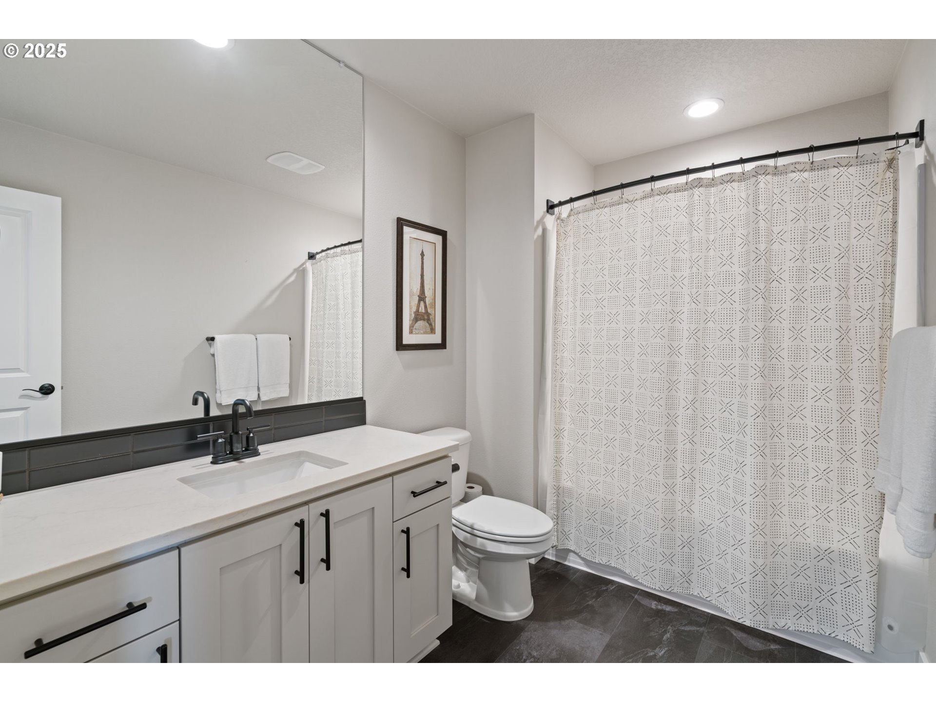 8842 North 3rd Circle Ridgefield, WA 98642 - Photo 34 of 46 a bathroom with a sink a toilet a mirror and shower