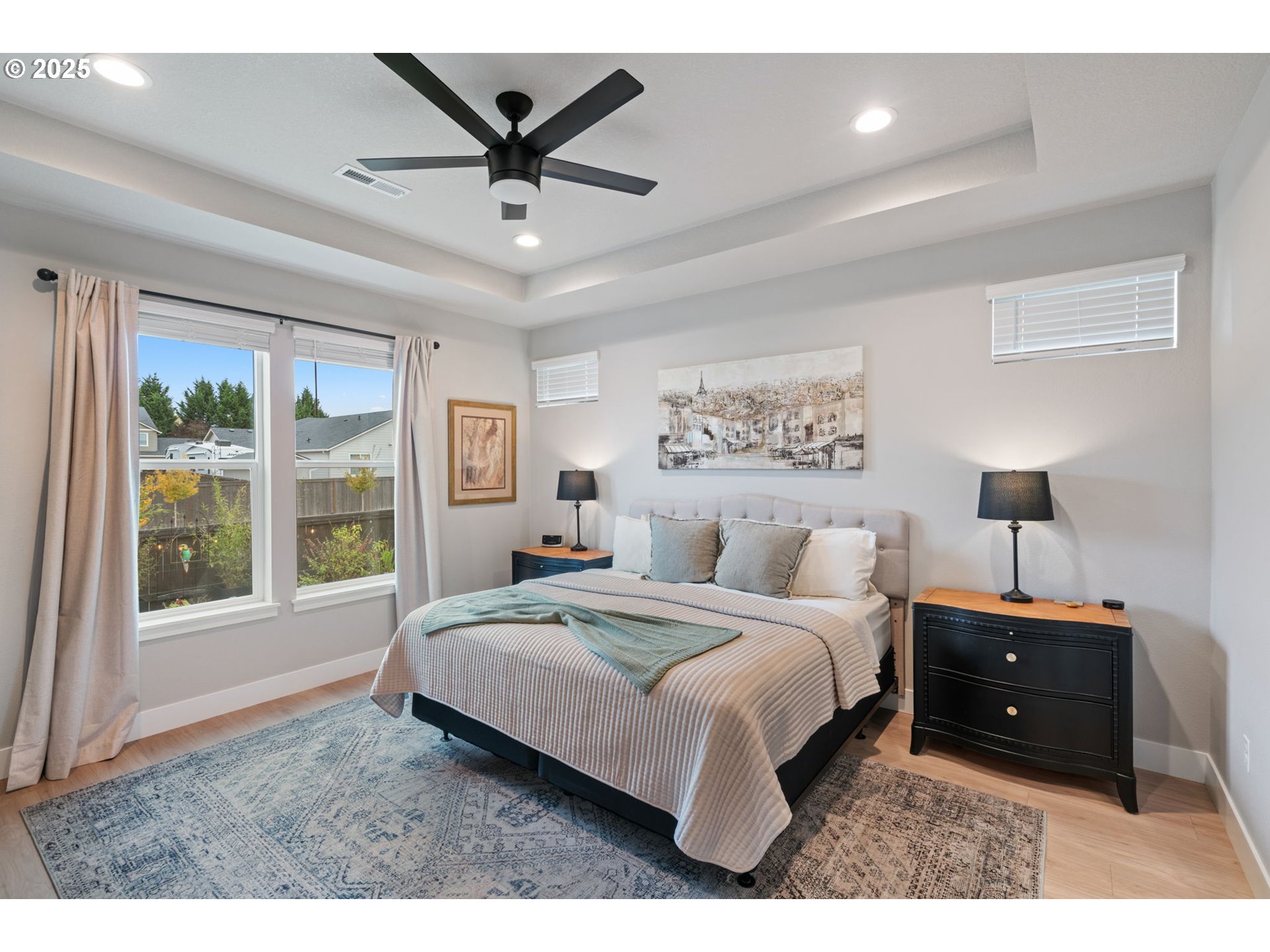 8842 North 3rd Circle Ridgefield, WA 98642 - Photo 6 of 46 a bedroom with a large bed and a large window