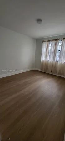 a black and white vase with flowers on it