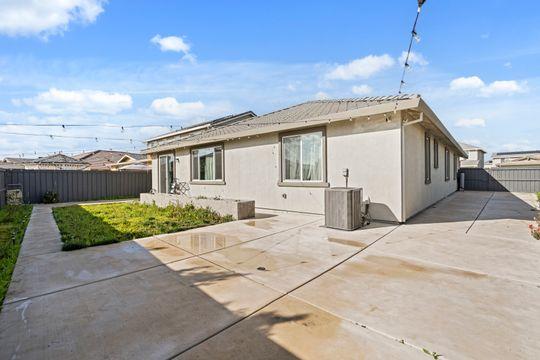 912 Loon Street Lathrop, CA 95330 - Photo 17 of 27 a front view of a house with a yard