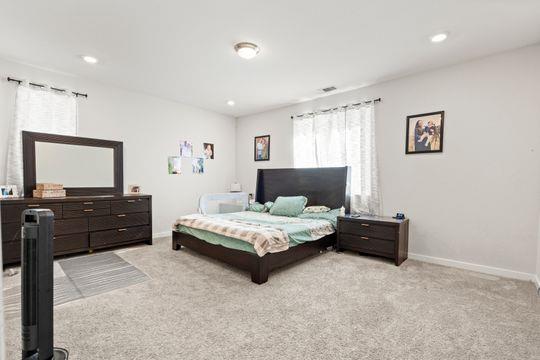 912 Loon Street Lathrop, CA 95330 - Photo 18 of 27 a living room with furniture and a flat screen tv