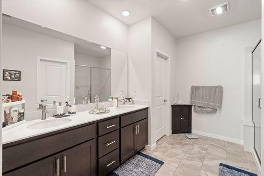 912 Loon Street Lathrop, CA 95330 - Photo 2 of 27 a en suite bathroom with double vanity and a mirror