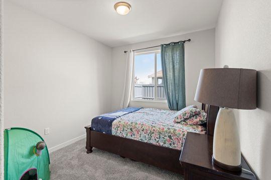 912 Loon Street Lathrop, CA 95330 - Photo 23 of 27 a bedroom with a bed and a window