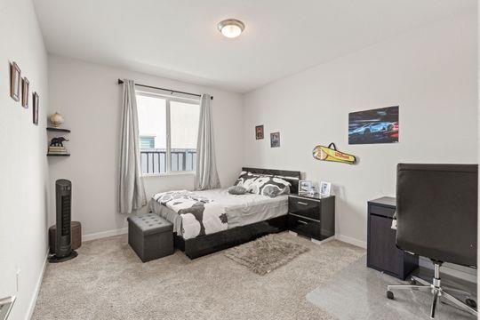 912 Loon Street Lathrop, CA 95330 - Photo 26 of 27 a bedroom with a bed and a window