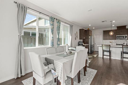 912 Loon Street Lathrop, CA 95330 - Photo 7 of 27 a view of a dining room with furniture window and wooden floor