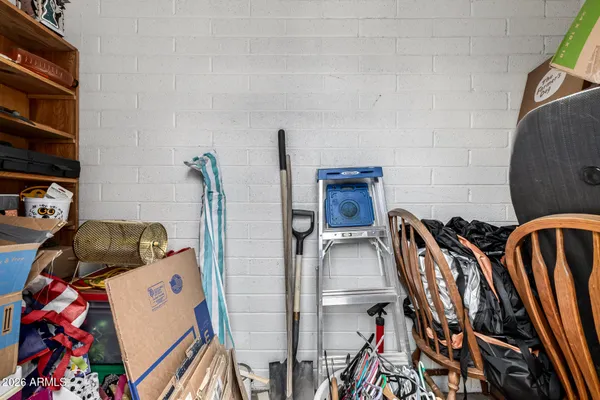 a view of storage and utility room with chairs