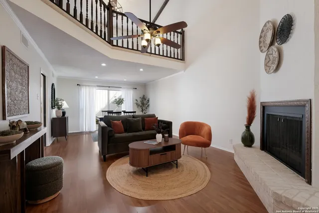 a living room with furniture and a fireplace