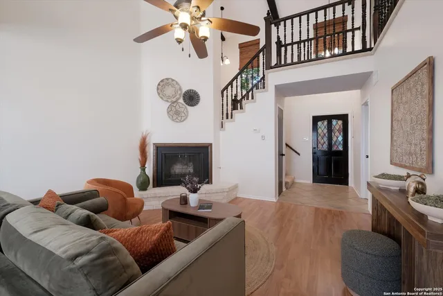 a living room with furniture and a fireplace