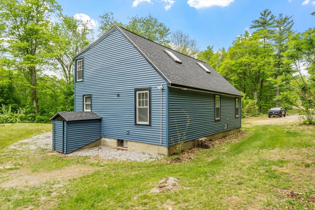 258 Allen Road Ashby, MA 01431 - Photo 4 of 36 a front view of a house with a yard