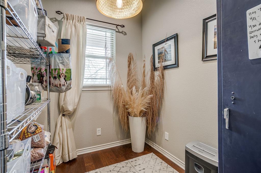 1615 Sanger Drive Springtown, TX 76082 - Photo 15 of 40 a view of a hallway with windows and closet