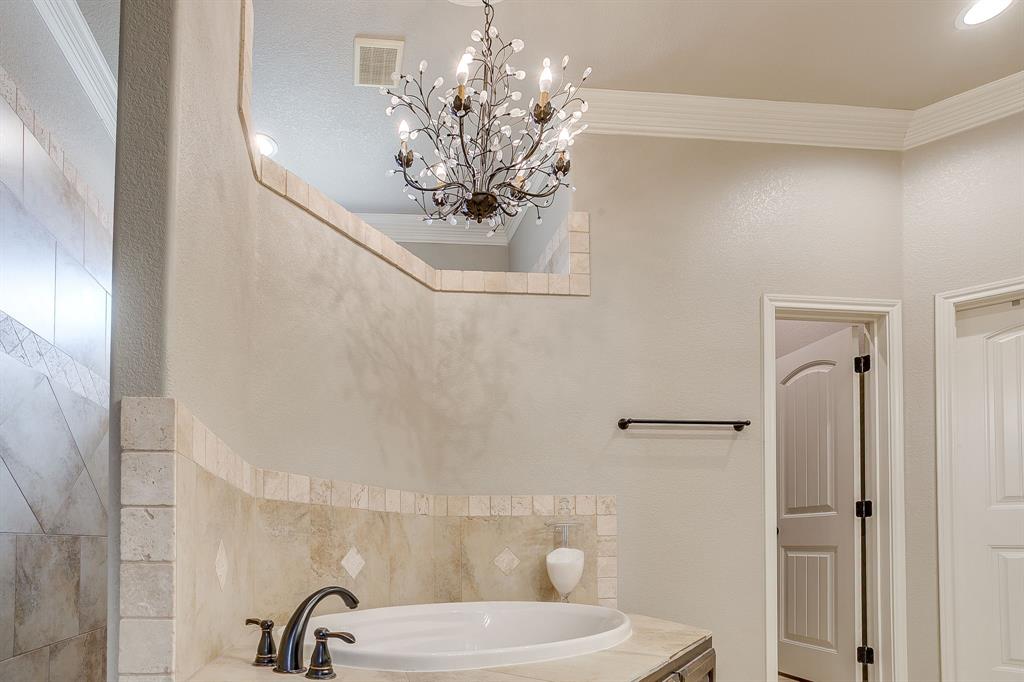 1615 Sanger Drive Springtown, TX 76082 - Photo 18 of 40 a bathroom with a sink and mirror