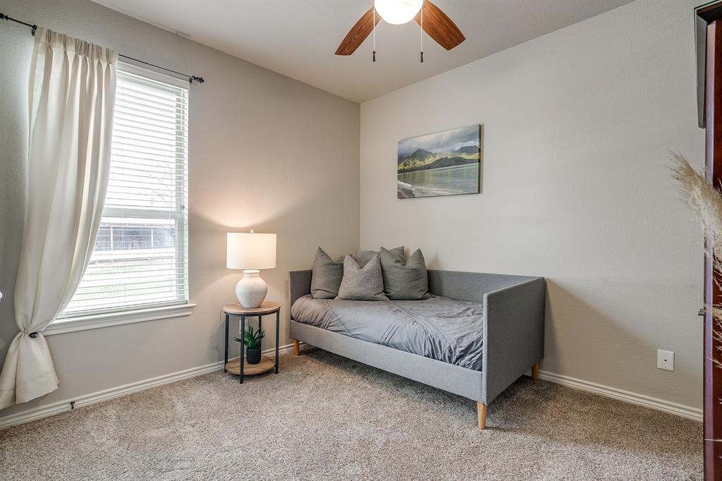 1615 Sanger Drive Springtown, TX 76082 - Photo 21 of 40 a living room with furniture and a window