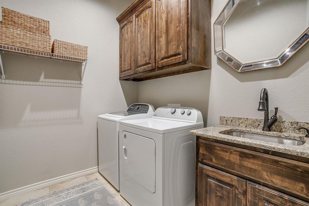 1615 Sanger Drive Springtown, TX 76082 - Photo 24 of 40 a utility room with dryer and washer