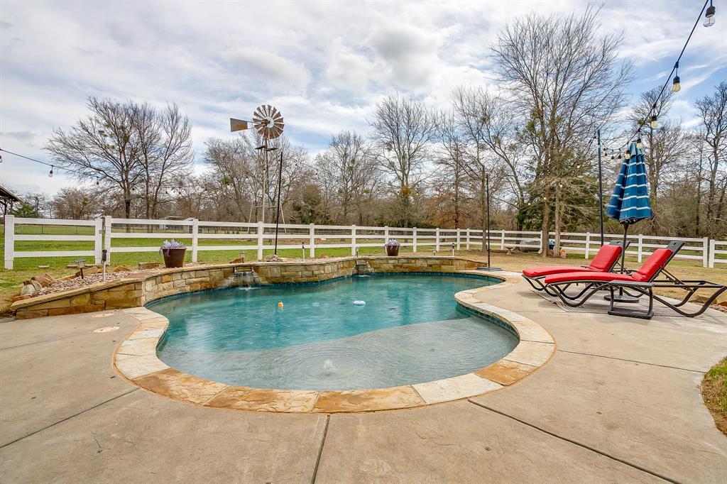 1615 Sanger Drive Springtown, TX 76082 - Photo 25 of 40 a view of a swimming pool with a patio