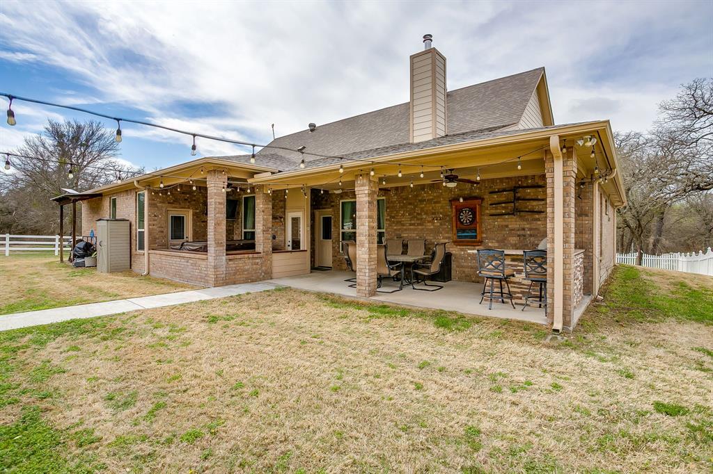 1615 Sanger Drive Springtown, TX 76082 - Photo 28 of 40 a view of a building with a patio