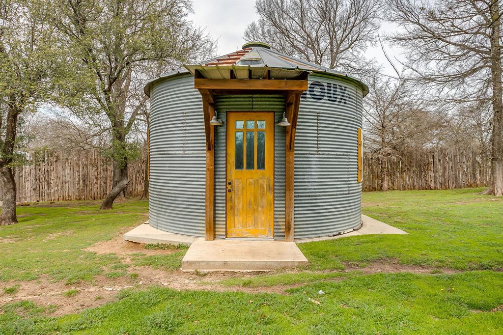1615 Sanger Drive Springtown, TX 76082 - Photo 30 of 40 a front view of a house with garden