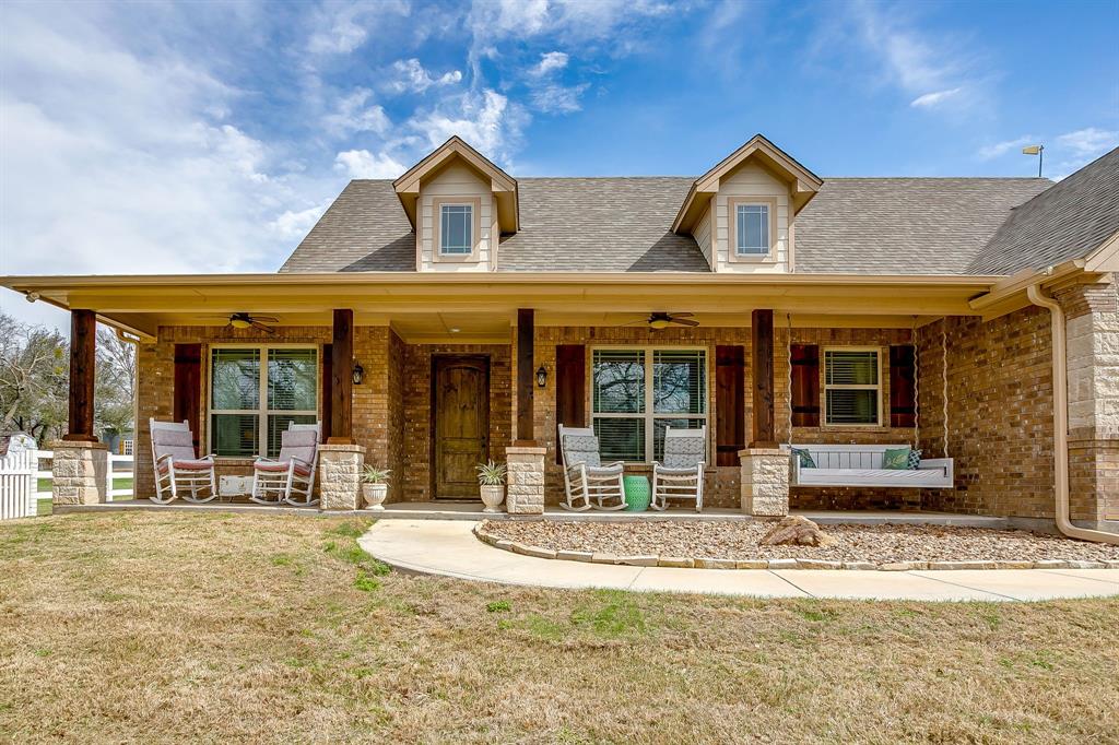 1615 Sanger Drive Springtown, TX 76082 - Photo 4 of 40 front view of a building with a fountain