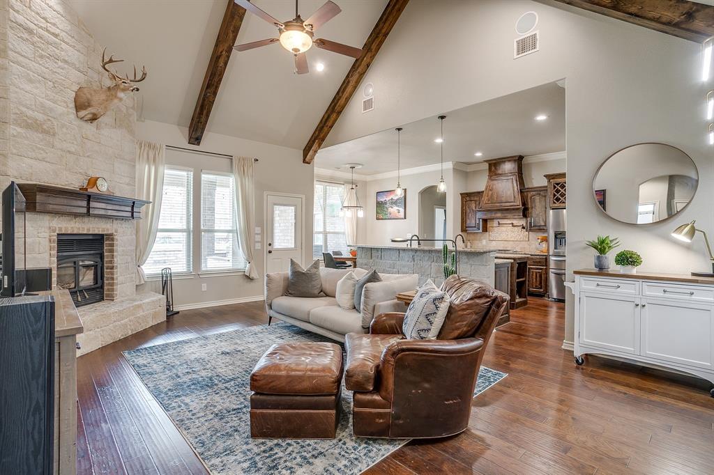 1615 Sanger Drive Springtown, TX 76082 - Photo 6 of 40 a living room with furniture and a fireplace