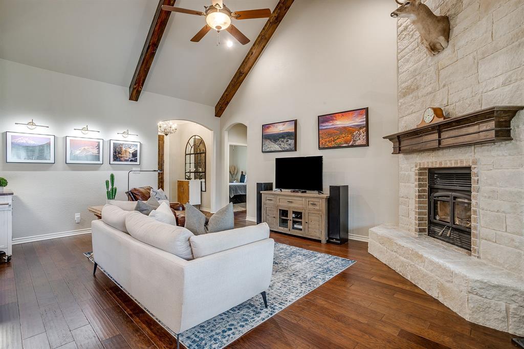 1615 Sanger Drive Springtown, TX 76082 - Photo 7 of 40 a living room with furniture and a flat screen tv
