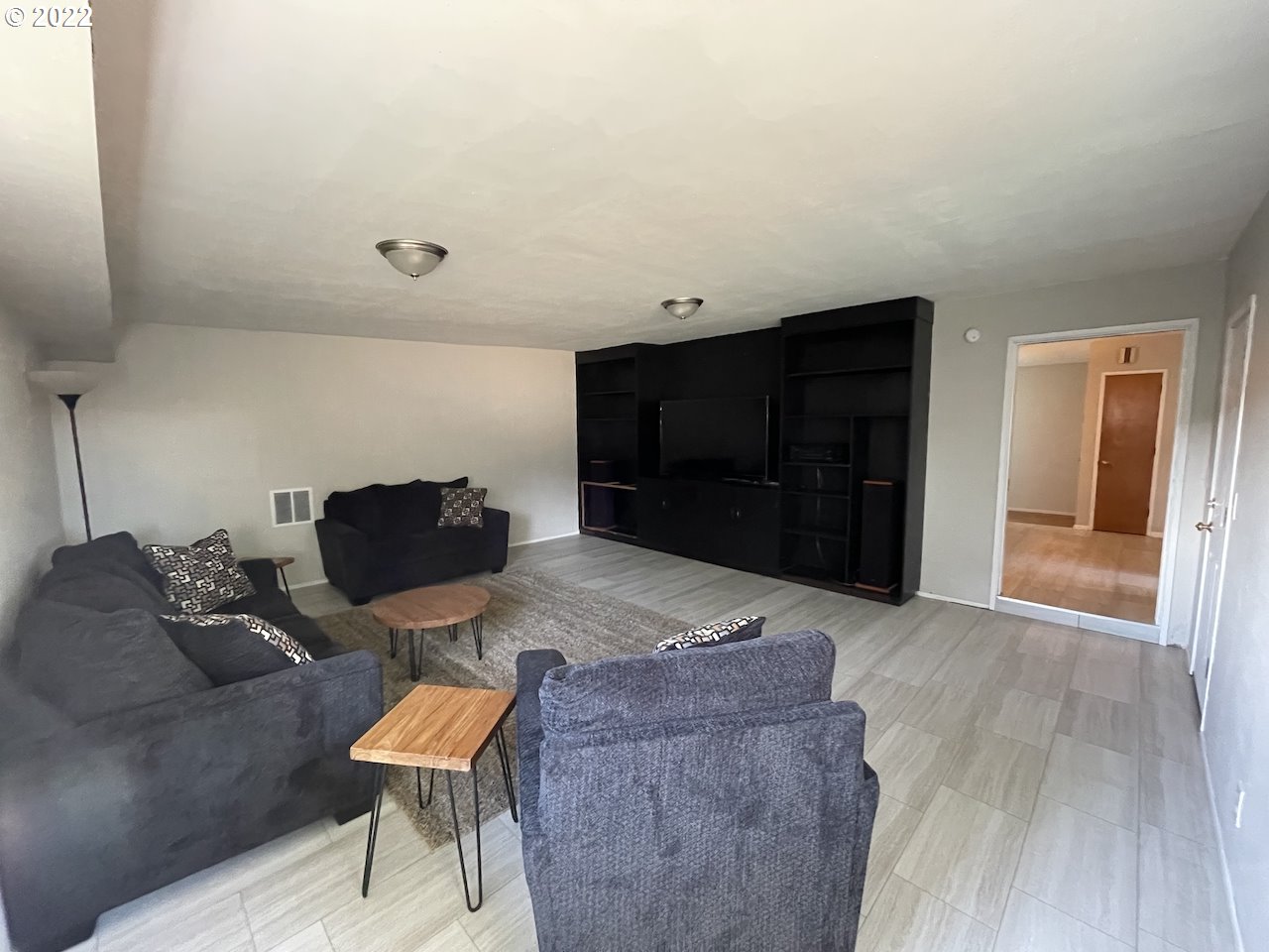 3203 Raleighwood Avenue Springfield, OR 97477 - Photo 12 of 28 a living room with furniture and a flat screen tv