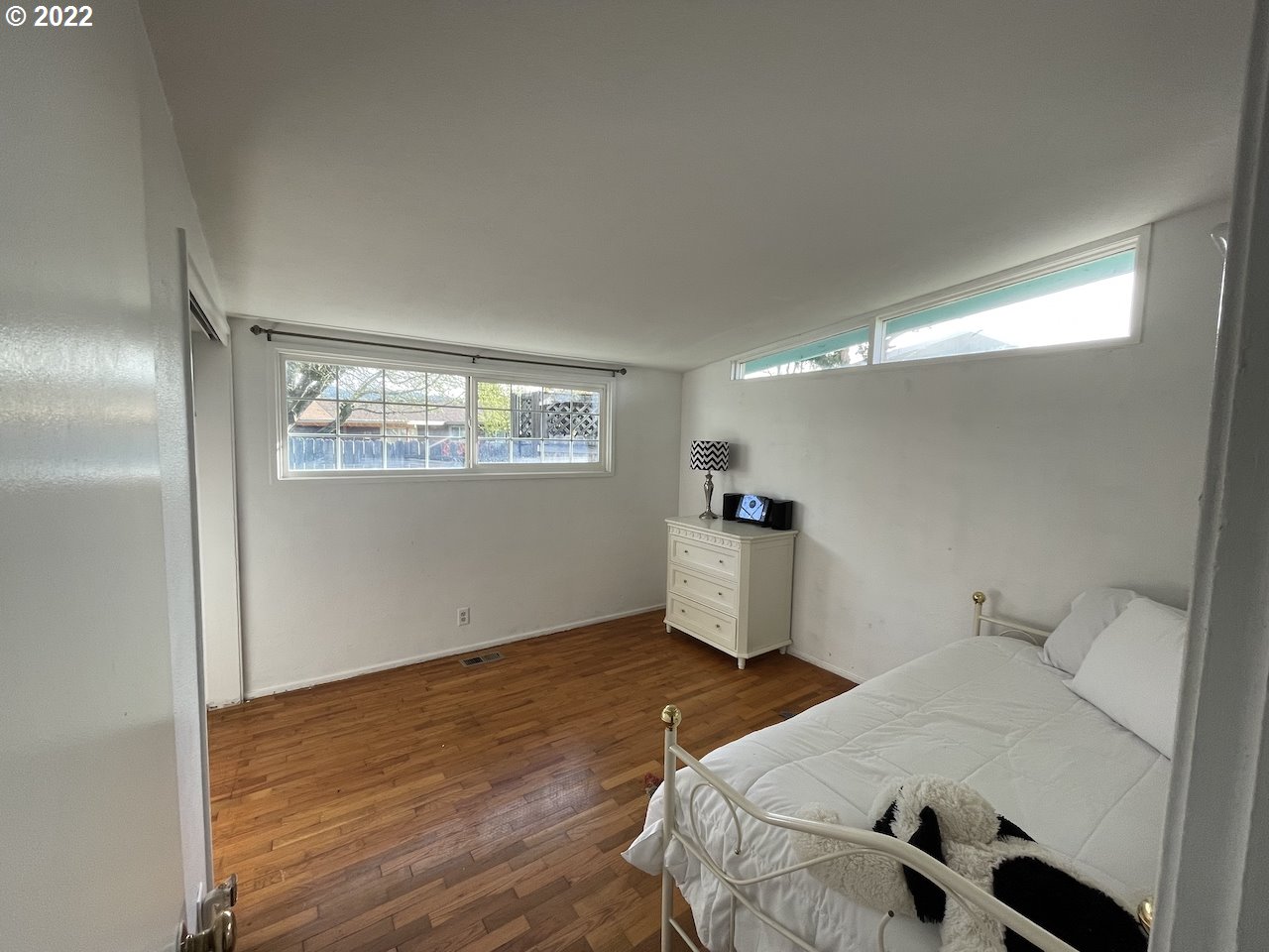 3203 Raleighwood Avenue Springfield, OR 97477 - Photo 15 of 28 a bedroom with a bed and a window