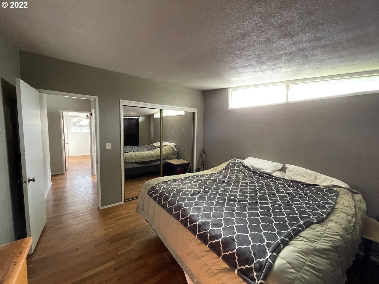 3203 Raleighwood Avenue Springfield, OR 97477 - Photo 16 of 28 a bedroom with a bed and wooden floor