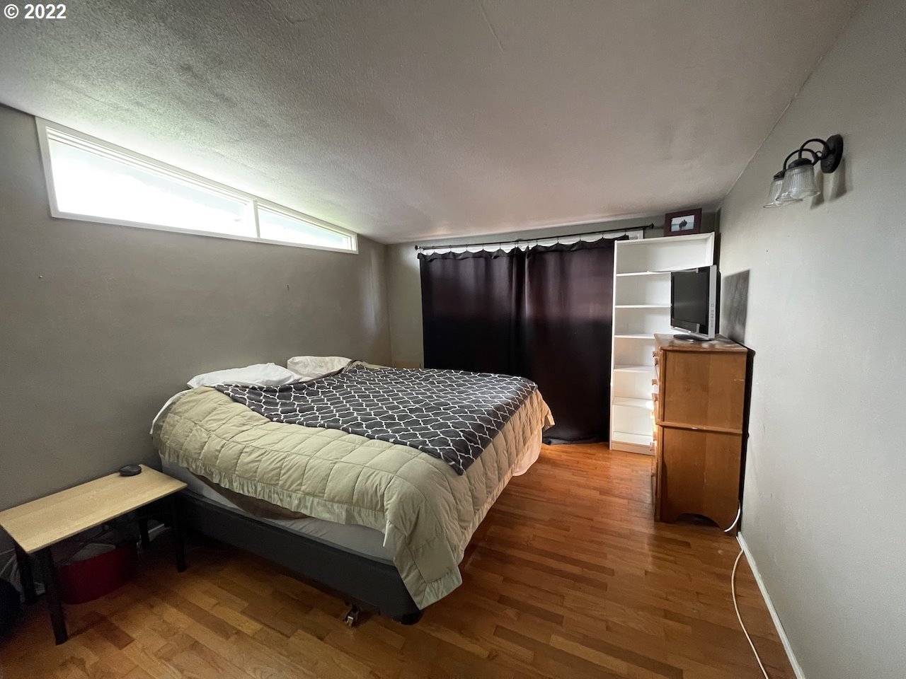 3203 Raleighwood Avenue Springfield, OR 97477 - Photo 17 of 28 a bedroom with a bed and wooden floor