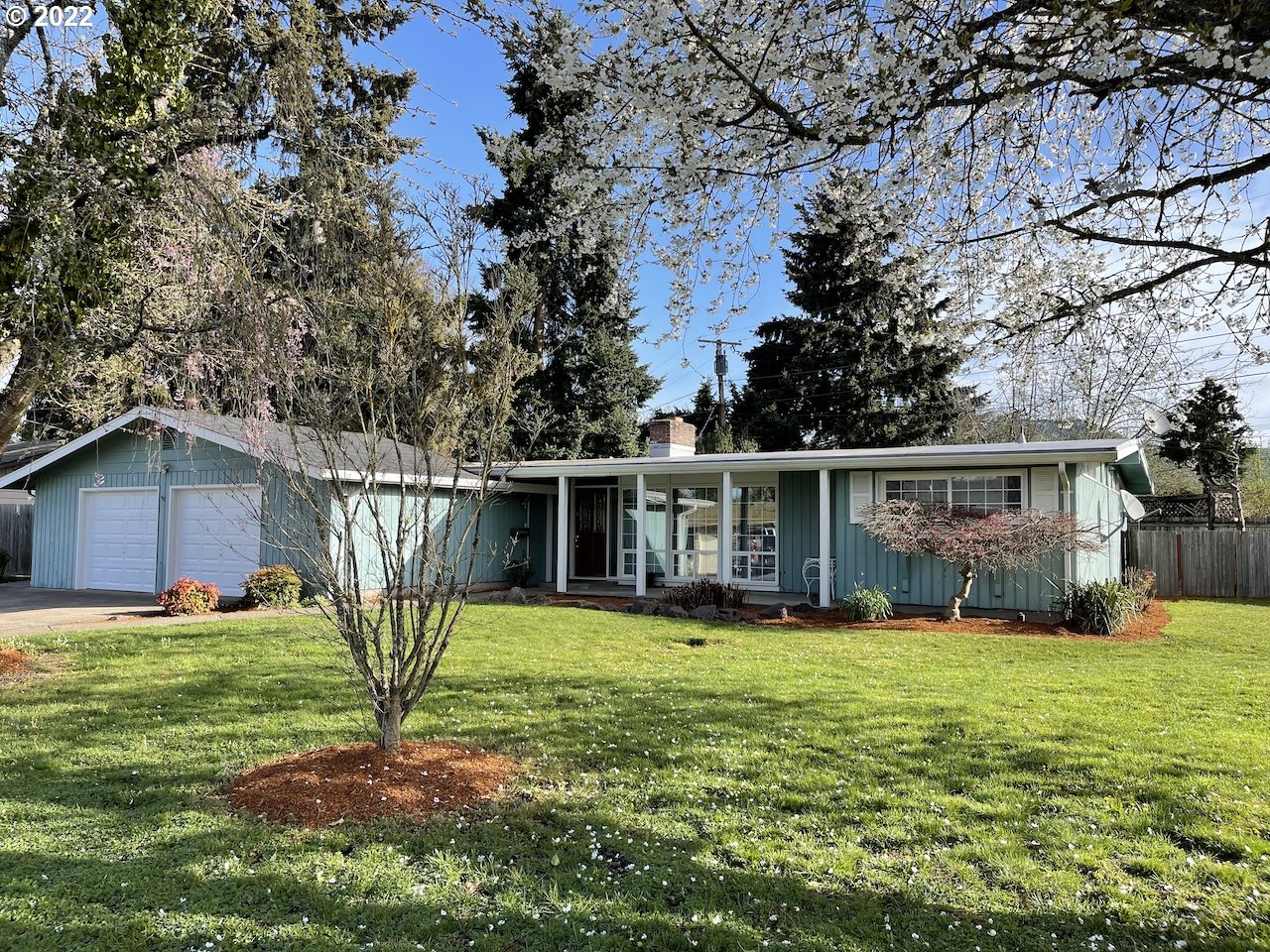 3203 Raleighwood Avenue Springfield, OR 97477 - Photo 2 of 28 a view of a house with a yard and sitting area