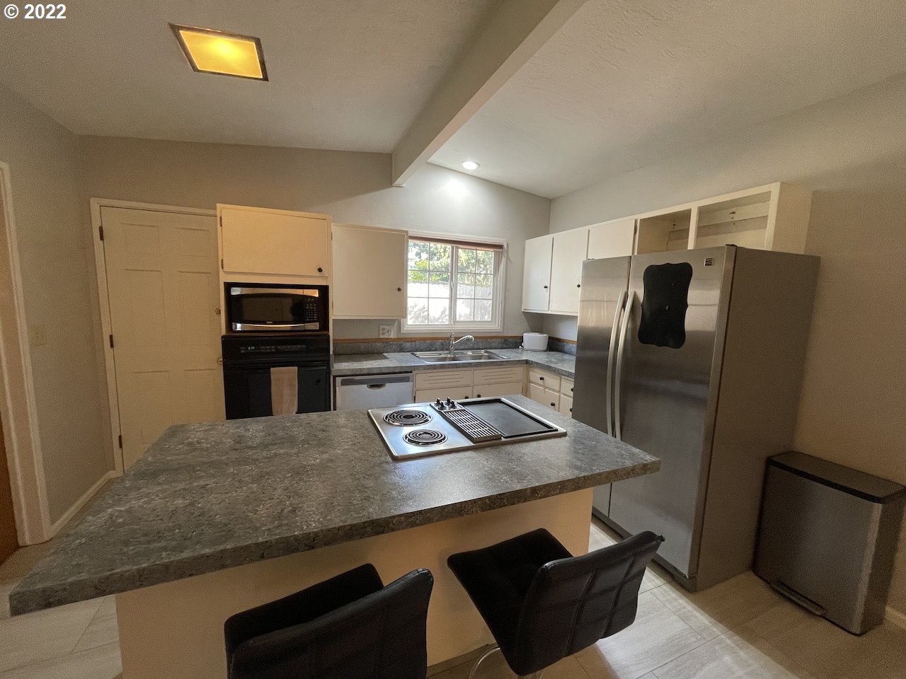 3203 Raleighwood Avenue Springfield, OR 97477 - Photo 6 of 28 a kitchen with stainless steel appliances granite countertop a refrigerator and a stove top oven