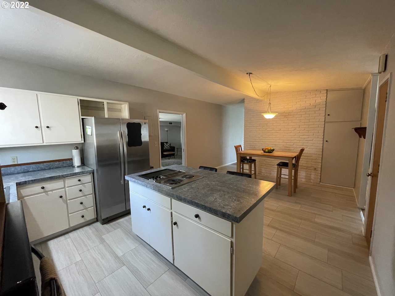 3203 Raleighwood Avenue Springfield, OR 97477 - Photo 9 of 28 a kitchen with stainless steel appliances granite countertop a sink stove and refrigerator