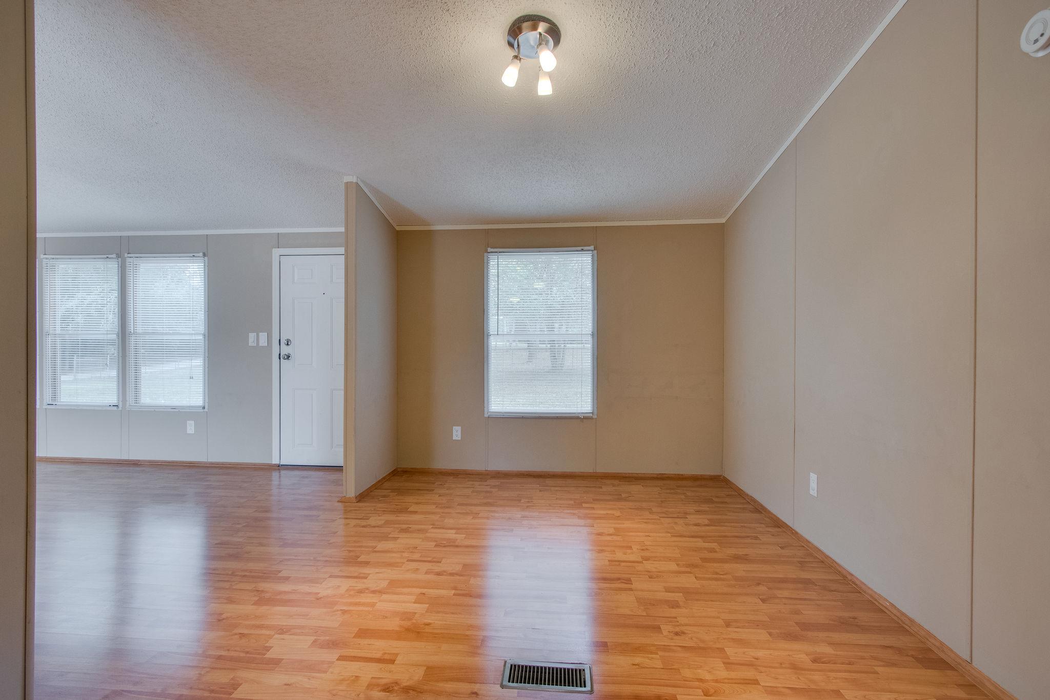 624 Speck Road Lebanon, TN 37087 - Photo 24 of 30 a view of an empty room with wooden floor and a window