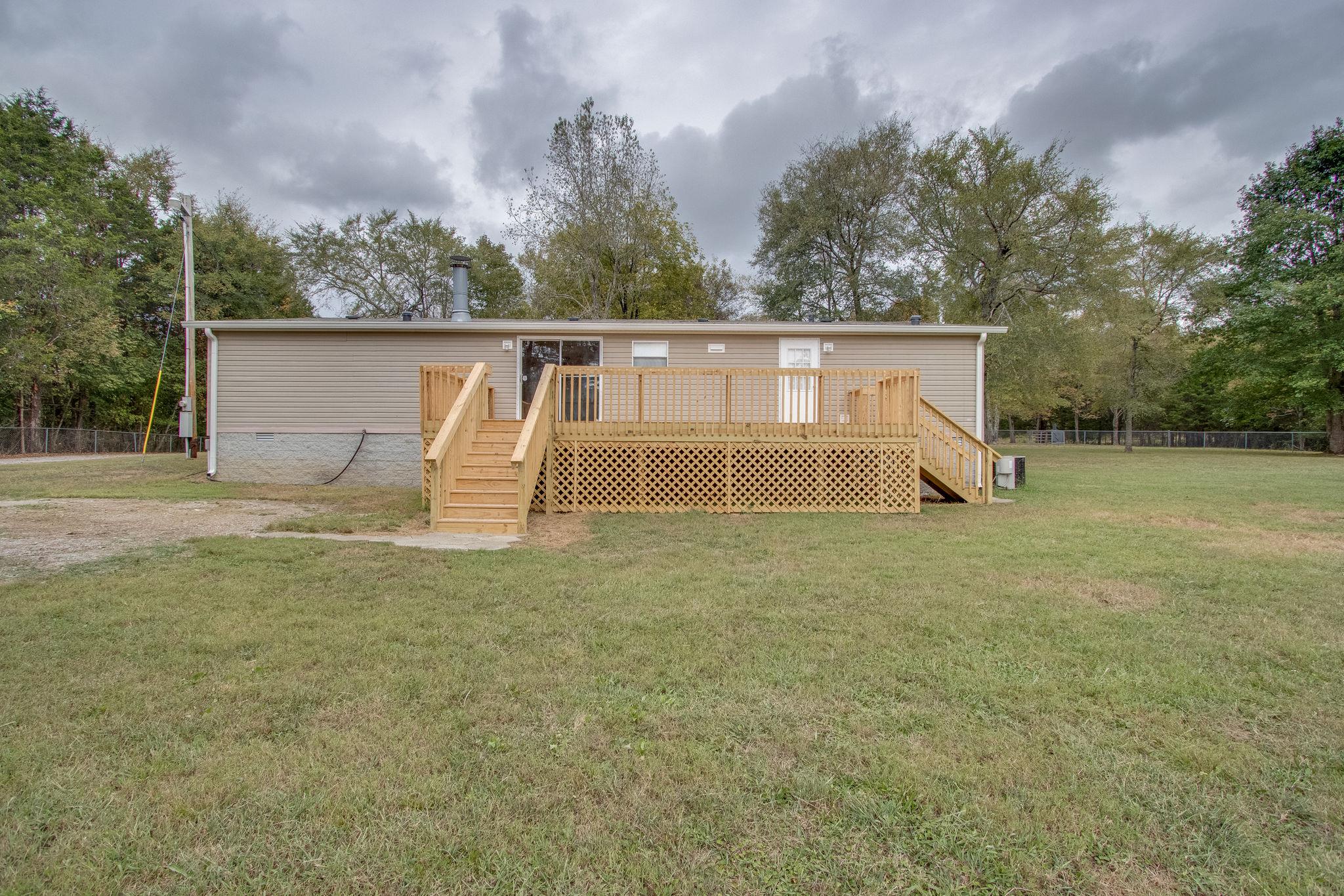 624 Speck Road Lebanon, TN 37087 - Photo 5 of 30 a view of a house with backyard and trees