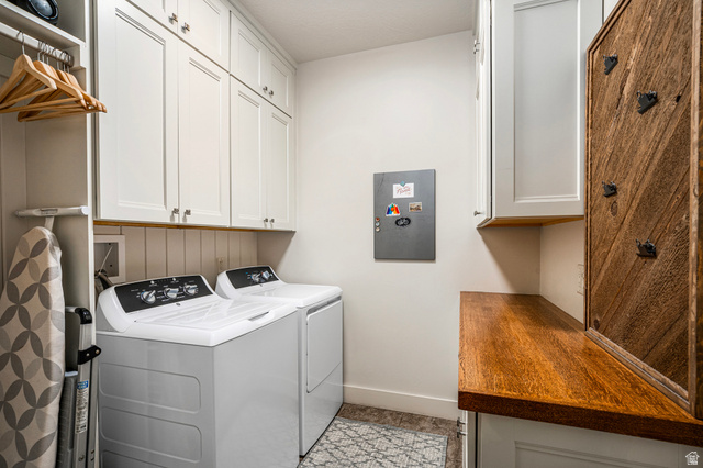 2311 South 1340 West St. George, UT 84770 - Photo 26 of 56 Laundry area featuring cabinet space and washing machine and dryer