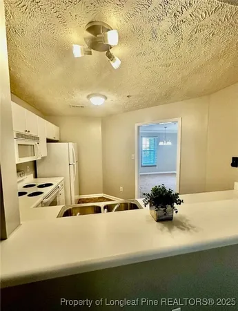 a picture of a room with a table and chairs