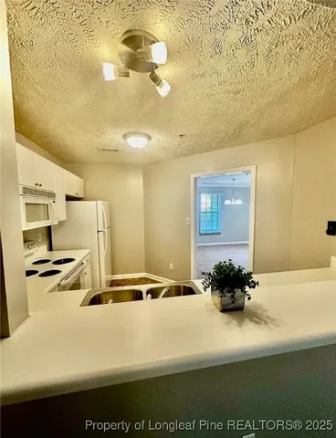 a picture of a room with a table and chairs