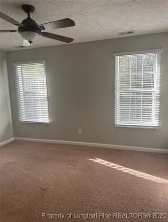 a view of a bathroom from a hallway