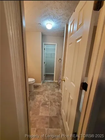 a bathroom with a sink toilet and mirror