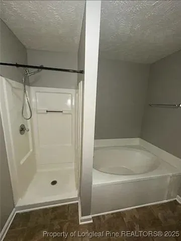 a bathroom with a tub sink and vanity