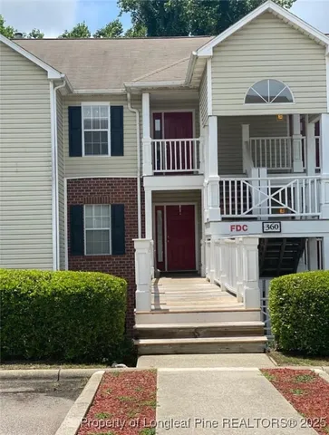 a view of front a house with a yard