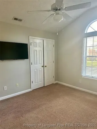 a view of walk in closet with window