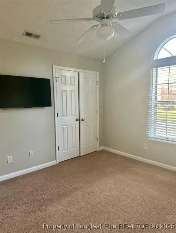 360 Bubble Creek Court, Unit 11 Fayetteville, NC 28311 - Photo 33 of 48 an empty room with windows and fan