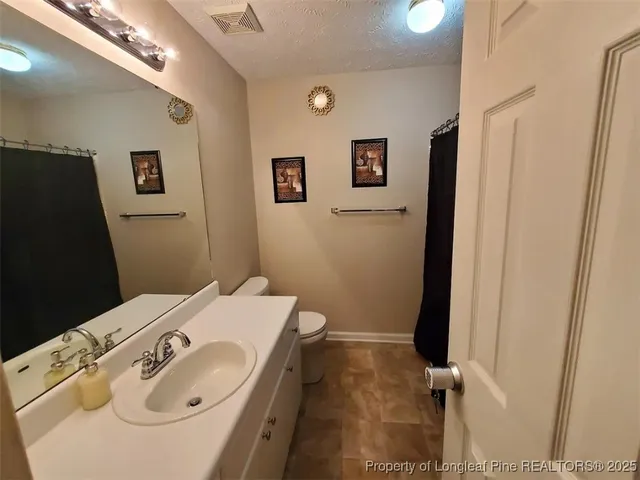 a bathroom with a sink and toilet