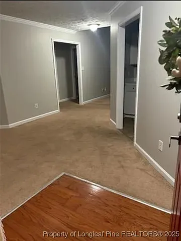 an empty room with wooden floor