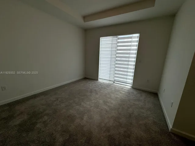 a view of a room that has a window in it