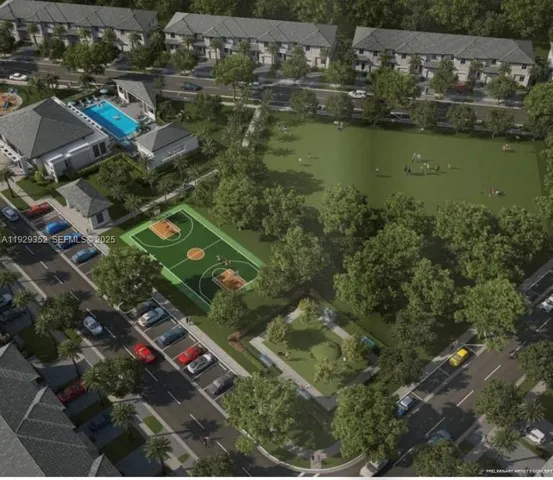 an aerial view of residential houses with outdoor space and lake view