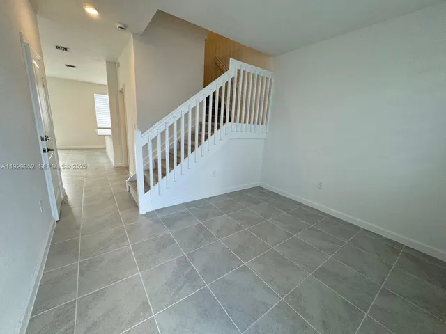 a view of an entryway with staircase