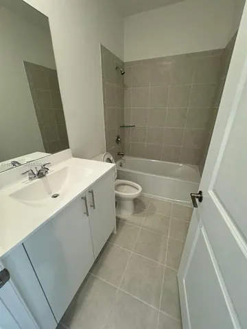 a room with window and pool table